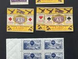 a group of four different stamps on a black surface