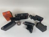 an image of a group of old cameras sitting on top of a table