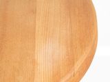 a close up of a wooden table with a white background