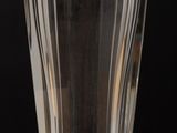 a glass of water sitting on a wooden table