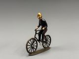 a figurine of a man riding a bike