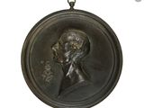 portrait d'un homme barbu dans un médaillon en bronze