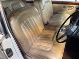 a brown leather seat in the back of a car