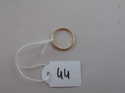 a tag with the word wu on it and a gold ring