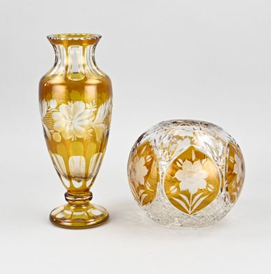 two vases sitting next to each other on a table