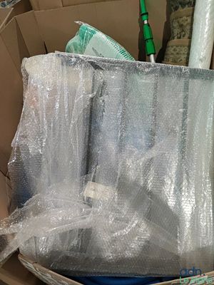 a box full of toiletries wrapped in clear plastic