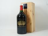 a bottle of wine sitting next to a wooden box