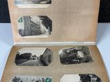 an old photo of an open book with pictures of people and animals on it