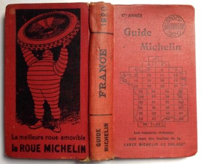an old red book with a picture of a little boy holding a frisbee on top of it