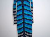 a woman ' s blue and black striped dress on a mannequin mannequin