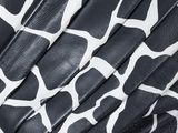 black and white giraffe print leather jacket on a white background