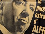 a poster with a picture of a man in a suit and tie