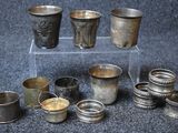 many cups that are sitting on a clear stand