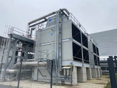 a large building that has a lot of pipes on it