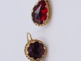 three pairs of garnets with red stones on them