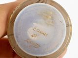 a person holding a small bowl with writing on it