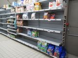 a lot of shelves that have food on them in a store