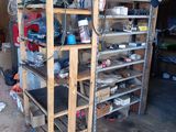 a garage with a lot of tools on the shelves
