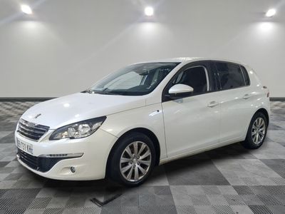 the white car is parked on a checkered tile floor