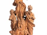 an image of a statue of a woman and children on a rock