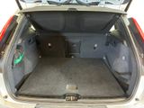 a trunk of a car with a sub in the back