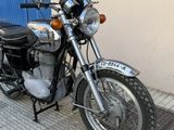 a motorcycle that is parked on the side of the street
