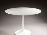 an image of a white table with a marble top on a grey background