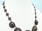 a close up of a necklace on a mannequin mannequin