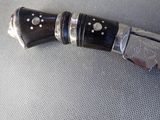 a knife that is laying on a table
