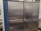 a large stainless steel refrigerator in a commercial kitchen
