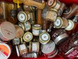 a red bin filled with jars of food and condiments