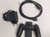 a video game controller and a charger on a table