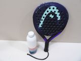 a tennis racquet and a bottle of water on a table