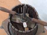 a metal bucket that has a wooden handle in it