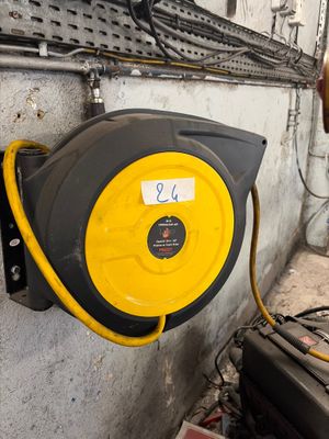 a yellow and black hose attached to a wall