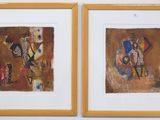 two framed paintings of a man and a woman on a wall