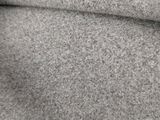 a close up of a blanket on a bed in a room