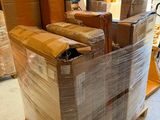 many boxes stacked on top of a pallet in a warehouse
