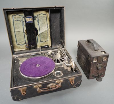 two suitcases and a record player sitting next to each other