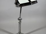 a cell phone sitting on a stand on a table
