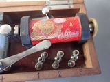 an old fashioned sewing machine in a wooden box