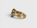 a close up of a gold ring with a blue topaz stone
