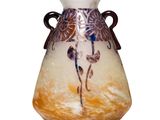 a glass vase with a painting on it sitting on a table