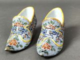 pair of blue and yellow shoes with floral designs on them