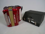two accordions sitting next to each other on a table