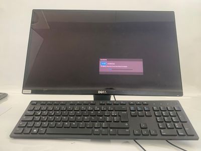 a dell computer with a keyboard and mouse on the desk