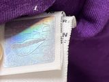 someone is holding a passport in their left hand and a passport in their right hand