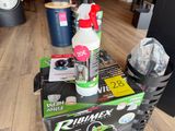 a box of cleaning products sitting on a wooden floor