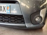 a close up of the front of a car with a license plate on it