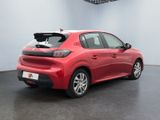the rear end of a red car in a showroom